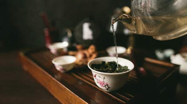 Editorial illustration for Gongfu Cha Versus Maghrebi Mint Tea: Distinct Expressions of Global Tea Culture